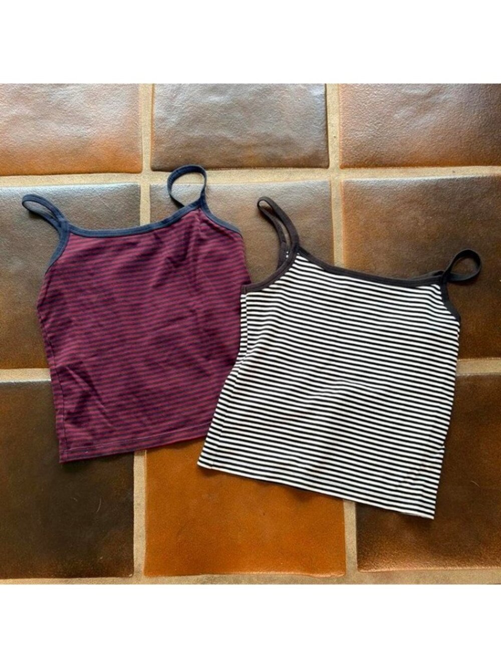 2 Uniqlo striped spaghetti-strap camisoles; tag shows size M, Made in Vietnam.